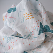 single swaddle blanket with blue clouds, yellow and pink lightening and rain
