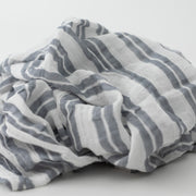 single swaddle blanket with double grey stripes on a white background