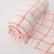 single swaddle blanket with orange crossed stripes 